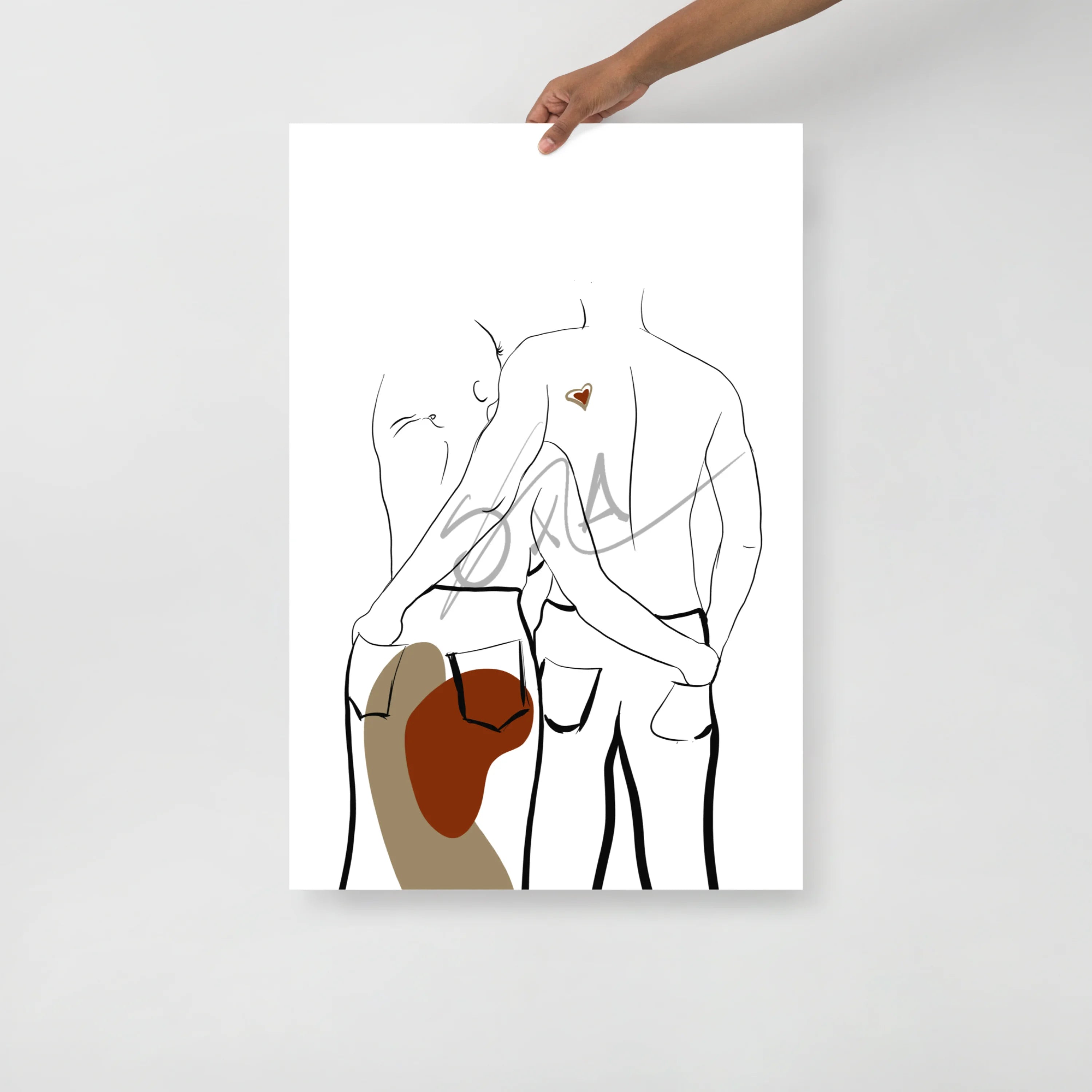wall art of couple with hands in each others back pockets